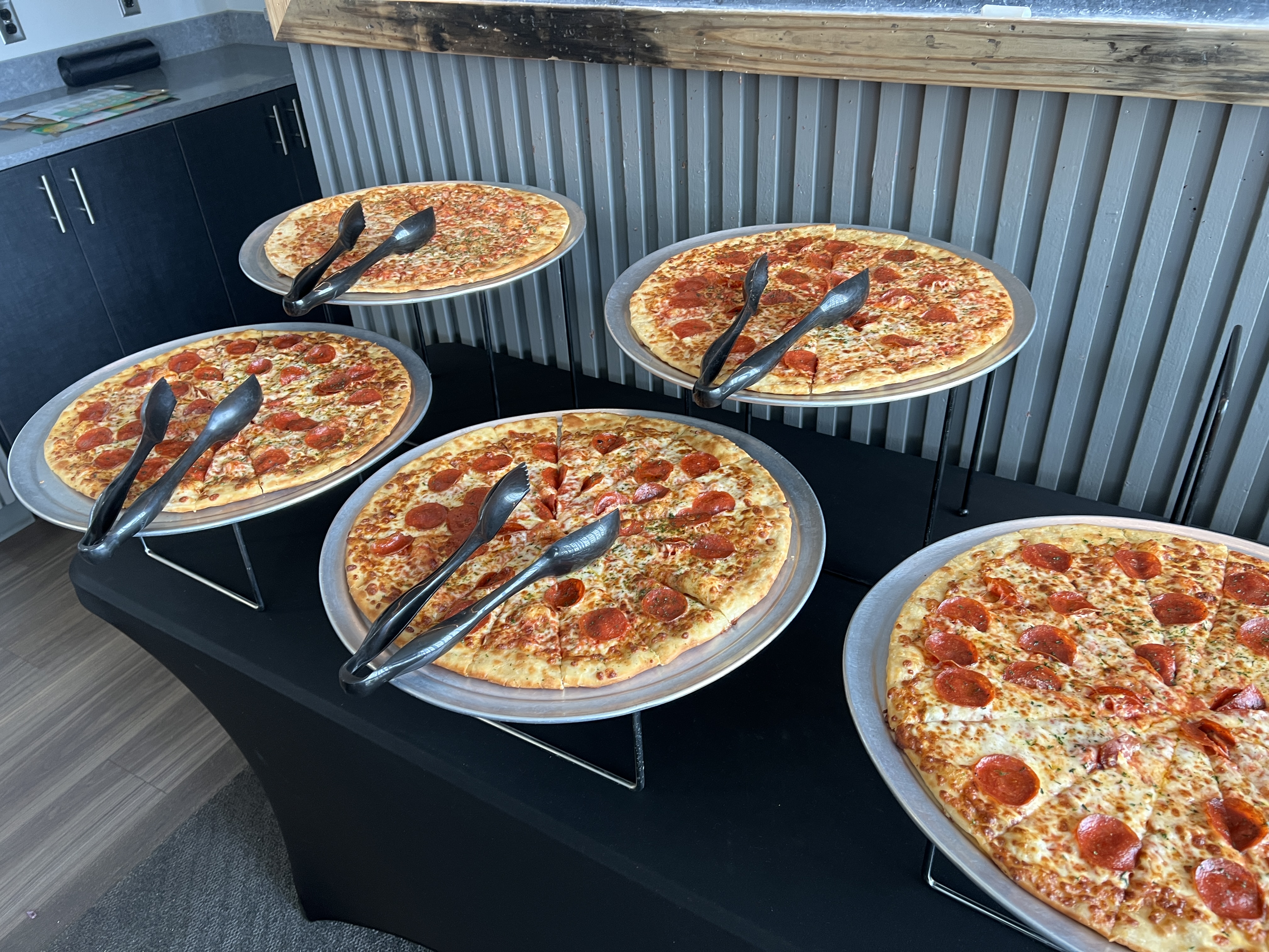 Pizza bar prepared for a group event at the 11th Frame Lounge