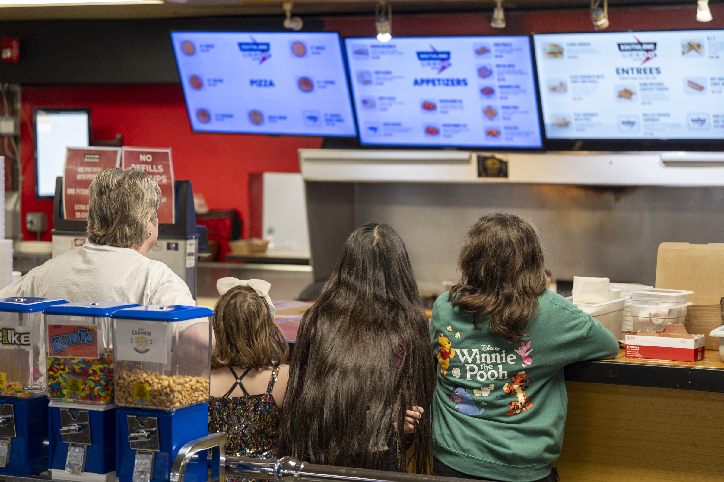 Guests ordering food at the 300 Grill counter inside Southland Bowling Lanes