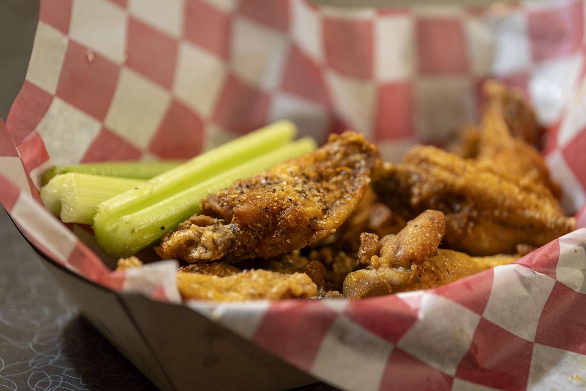 Seasoned wings served with fresh celery at the 300 Grill